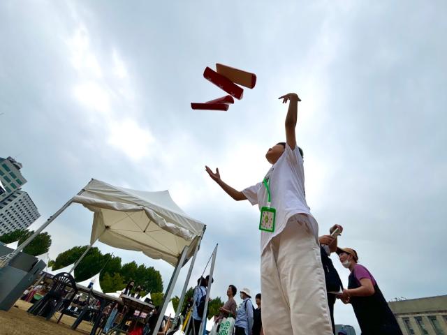 A child plays yunnori traditional Korean board game at the 2024 Seoul Market in Seoul Plaza on Sep 2 2024 AJP Han Jun-gu