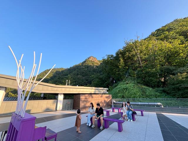 Visitors rest at the Mt Samak station of the cable car in the eastern city of Chuncheon Aug 31 2024 AJP Han Jun-gu