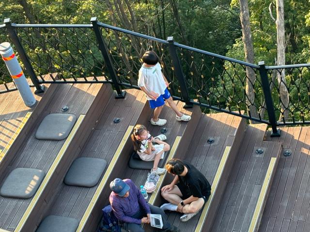 Visitors rest at the Mt Samak station of the cable car in the eastern city of Chuncheon Aug 31 2024 AJP Han Jun-gu