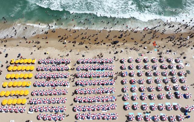 Visitors crowds Haeundae Beach in Busan Korea taken in this file photo on Jul 2024 Yonhap