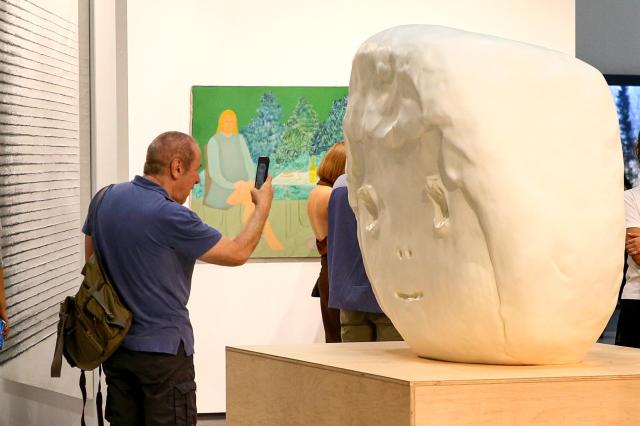 A visitor takes a photo of artwork at the international art fair FRIEZE SEOUL held at COEX in Seoul on Sep 5 2024