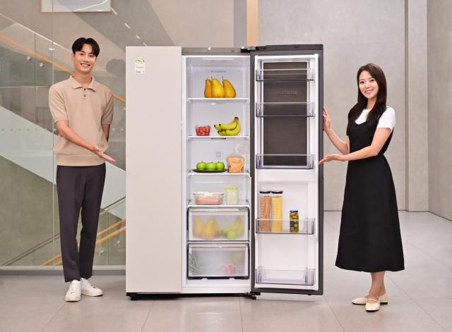 This photo shows models introducing Samsungs AI-equipped side-by-side refrigerator Courtesy of Samsung Electronics