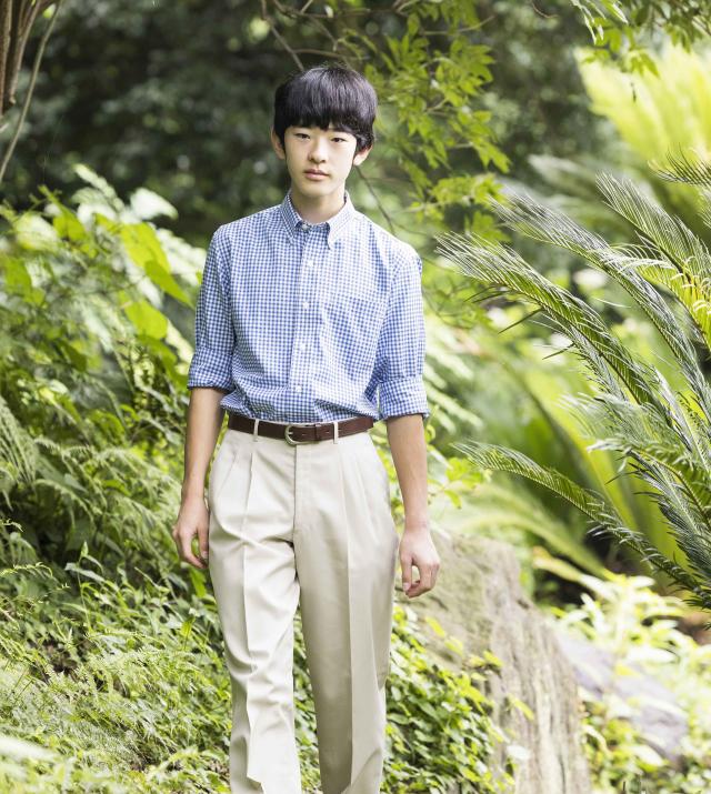 This photo shows Prince Hisahito the son of Crown Prince Akishino and Crown Princess Kiko walking in the Akasaka Palace imperial garden in Tokyo July 15 2024 Courtesy of the Imperial Household Agency of Japan