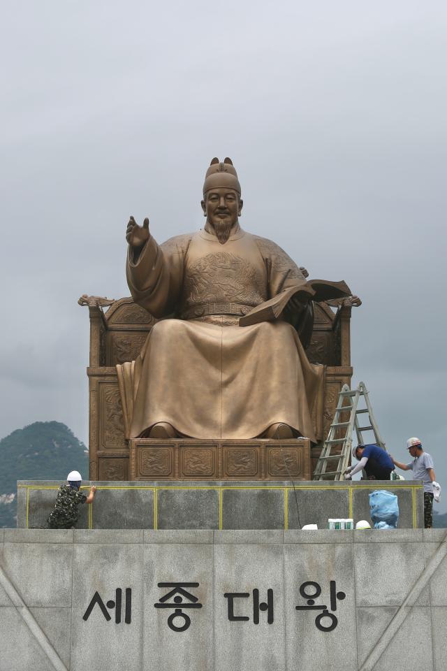 Workers conduct waterproofing work on the statue of King Sejong the Great in Gwanghwamun Plaza Seoul Sept 6 2024 AJP Han Jun-gu