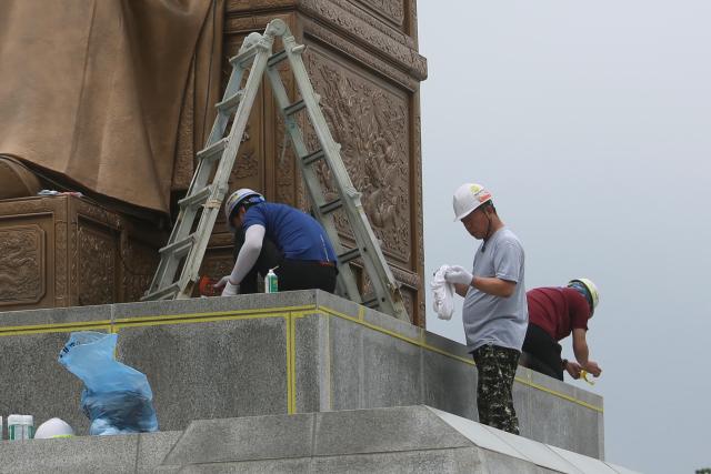 Workers conduct waterproofing work on the statue of King Sejong the Great in Gwanghwamun Plaza Seoul Sept 6 2024 AJP Han Jun-gu