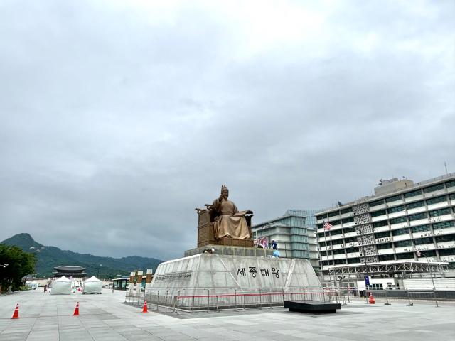 Workers conduct waterproofing work on the statue of King Sejong the Great in Gwanghwamun Plaza Seoul Sept 6 2024 AJP Han Jun-gu