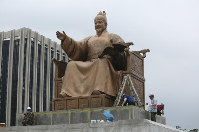 Workers conduct waterproofing work on the statue of King Sejong the Great in Gwanghwamun Plaza Seoul Sept 6 2024 AJP Han Jun-gu