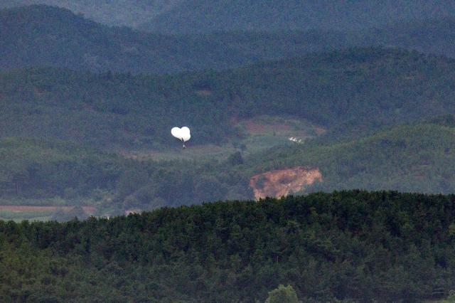 A trash-filled balloon rises from Kaepung County in North Korea near the inter-Korean border as seen from Paju South Korea on the morning of Sept 5 2024 Yonhap