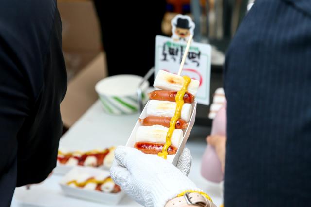 Sausage and Rice Cake Skewers on sale at a K-Shopping Festa booth at Cheonggye Plaza in Seoul on Sept 9 2024 AJP Kim Dong-woo
