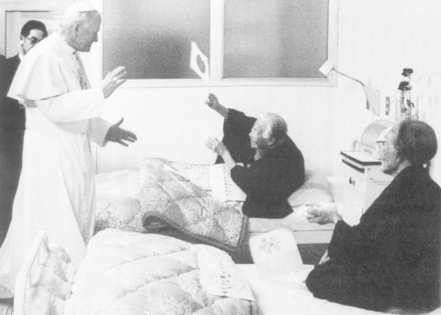 This photo shows a survivor of the A-bomb that destroyed Nagasaki in 1945 waving a Japanese flag to visiting Pope John Paul II Feb 26 1981 AP - Yonhap