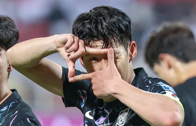 Son Heung-min celebrates after scoring a goal in the match between Korea and Oman during the third round of the 2026 World Cupqualifiers held at Sultan Qaboos Stadium in Muscat On September 10 2024 Yonhap