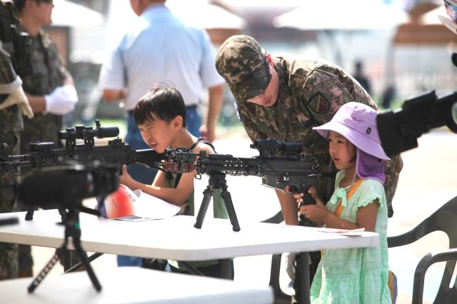 Children participate in military experience activities at the 74th anniversary commemoration of the Incheon Landing Operation in Incheon Sep 11 2024 AJP Han Jun-gu