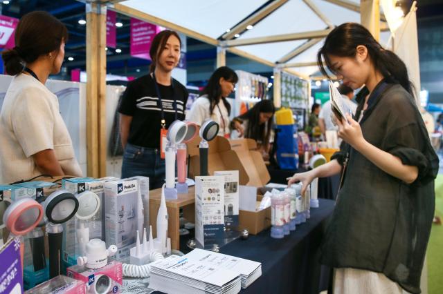 A visitor looks at a booth during the Korea Social Value Festa at COEX in Seoul on Sept 12 2024 AJP Kim Dong-woo