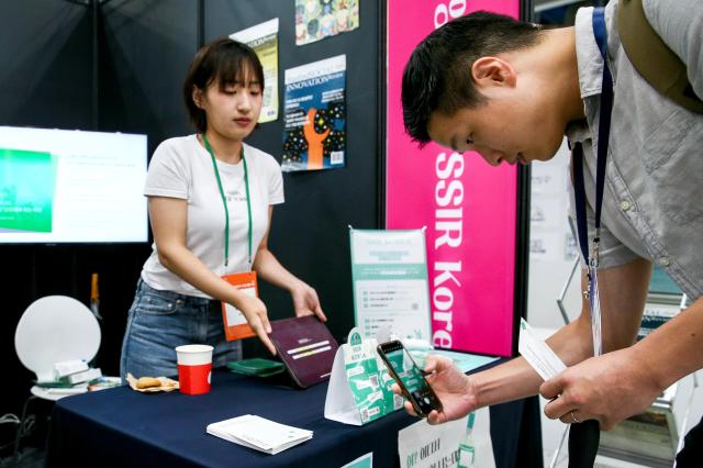 A visitor participates in a booth event during the Korea Social Value Festa at COEX in Seoul on Sept 12 2024 AJP Kim Dong-woo