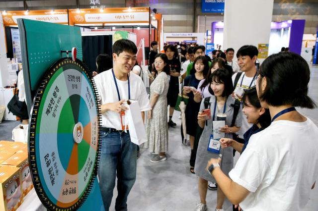 Visitors participate in a booth event during the Korea Social Value Festa at COEX in Seoul on Sept 12 2024 AJP Kim Dong-woo