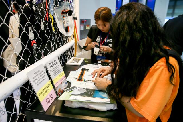 Visitors participate in a booth event during the Korea Social Value Festa at COEX in Seoul on Sept 12 2024 AJP Kim Dong-woo