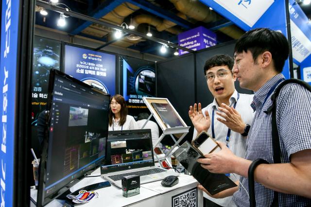 A visitor listens to a booth representative during the Korea Social Value Festa at COEX in Seoul on Sept 12 2024 AJP Kim Dong-woo