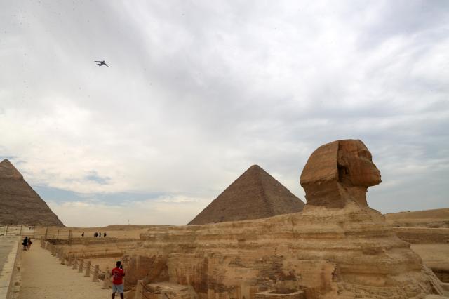 An aircraft flies over Giza Pyramids in Egypt Aug 28 2024 Xinhua-Yonhap