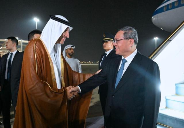 Chinese Premier Li Qiang shakes hands with Sheikh Mohammed bin Rashid Al Maktoum the UAEs Vice President and Prime Minister at Zayed International Airport in Abu Dhabi United Arab Emirates on September 11 2024 Xinhua-Yonhap