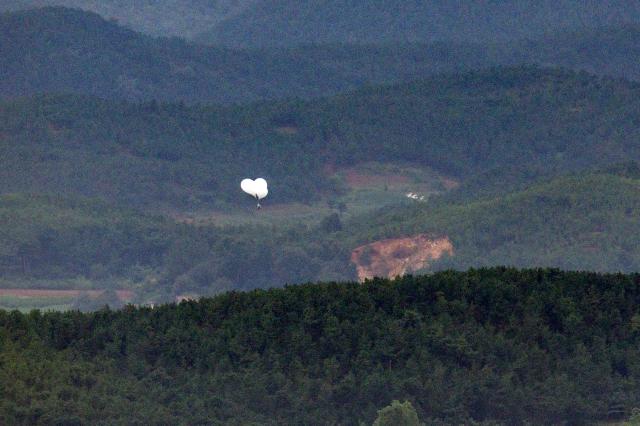 A waste balloon is rising from Gaepung County North Hwanghae Province North Korea as viewed from the Odusan Unification Observatory in Paju Gyeonggi Province on Sept 5 Yonhap