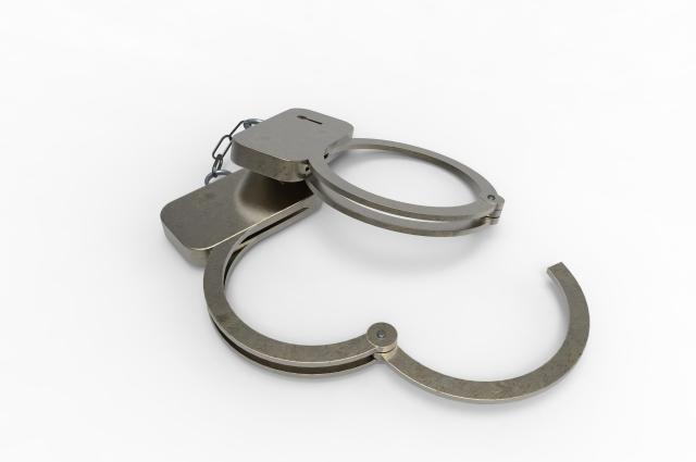 This picture shows a metal handcuff Getty Images Bank