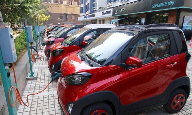 The image shows Electric vehicle charging station in China Reuters-Yonhap 