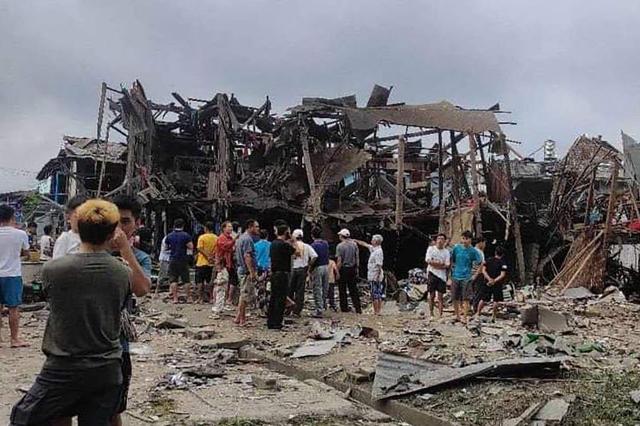 Civilians gathered around a bombed building in Namhkam Shan State following a Myanmar military airstrike that killed 11 and wounded 11 others on September 6 2024 AFP-Yonhap