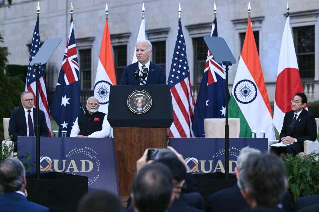 US President Joe Biden speaks as Australias Prime Minister Anthony Albanese left Indias Prime Minister Narendra Modi second from left and Japanese Prime Minister Fumio Kishida look on during a Cancer Moonshot event at the Quad leaders summit in Claymont Delaware US Sept 21 2024 AFP-Yonhap
