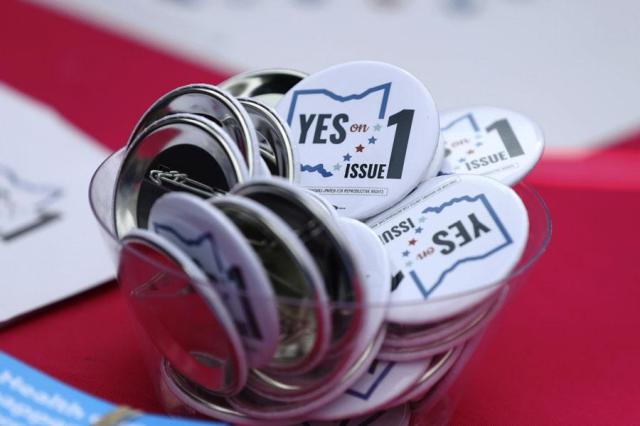 Buttons in support of Issue 1 the Right to Reproductive Freedom amendment sit on display at a rally held by Ohioans United for Reproductive Rights at the Ohio Statehouse in Columbus Ohio on Oct 8 2023 AP-Yonhap
