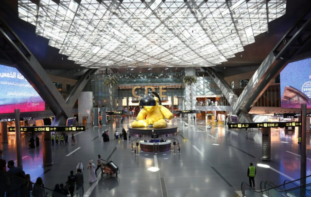 Passengers walk by at Hamad International Airport in Doha Qatar in this file photo taken in January 2021 REUTERS - Yonhap