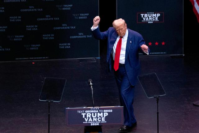 Republican presidential candidate and former President Donald Trump raises his hands at a campaign event in Georgia US on Sept 24 2024 AP-Yonhap