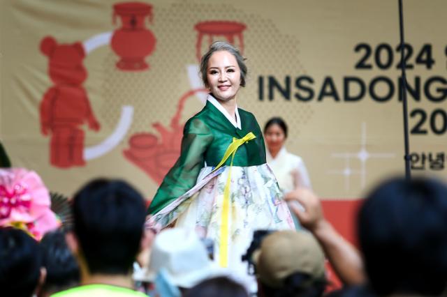 A hanbok fashion show takes place during the opening ceremony of the 2024 Insadong Antique  Art Fair in Insadong Jongno-gu Seoul on Sept 26 2024 AJP Kim Dong-woo