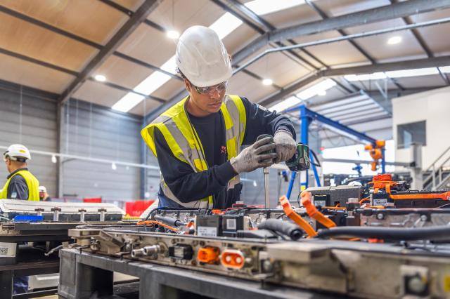 A worker taking apart used batteries in a battery recycling facility SK tes built in Rotterdam Netherlands Courtesy of SK Ecoplant