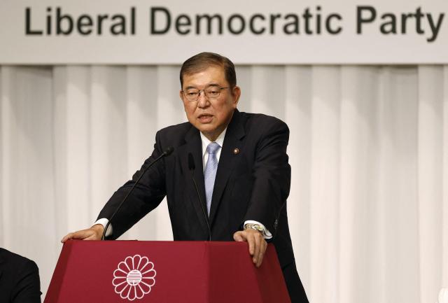 Former Japanese Defense Minister Shigeru Ishiba the new leader of Japans ruling party Liberal Democratic Partys leader speaks during a joint news conference at the LDP headquarters in Tokyo before his election Sept 13 2024 AFP-Yonhap