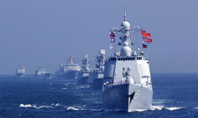 Chinese officers and soldiers wave farewell to the Russian fleet during a China-Russia joint naval drill off the coast of Guangdong Province southern China on September 19 2016 Xinhua-Yonhap