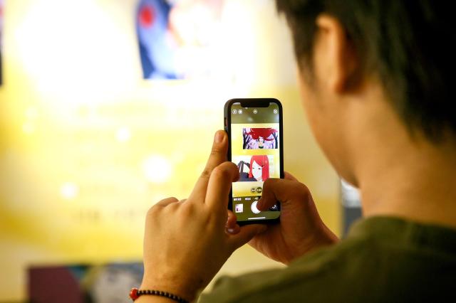 A visitor takes a photo at Naruto The Gallery held in Mapo-gu Seoul on Sept 27 2024 AJP Kim Dong-woo