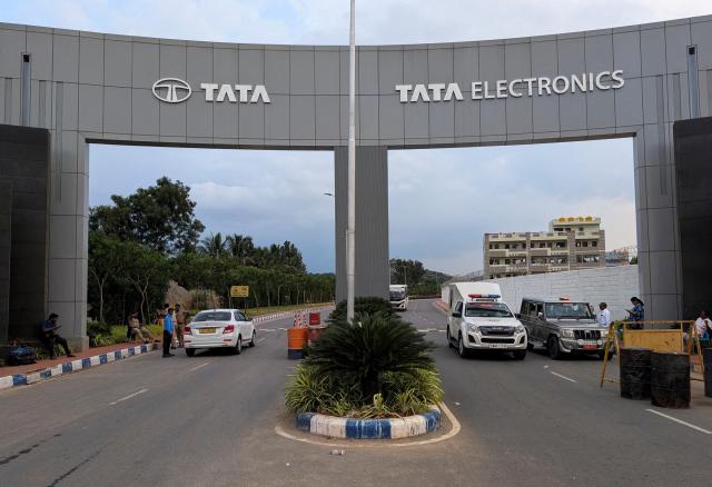 Vehicles pass through the security check at the entrance of a Tata Electronics plant which makes Apple iPhone components in Hosur Tamil Nadu India Sept 28 2024 Reuters-Yonhap