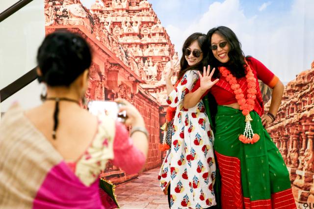 Visitors to the Sarang Festival an inaugural Indian cultural festival held at the Yonsei University Centennial Hall on Oct 1 pose for a selfie in front of a photo wall AJP Kim Dong-woo 