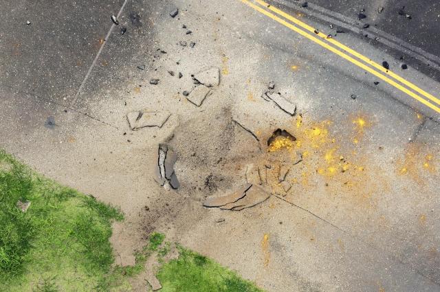 This photo shows parts of a damaged taxiway due to a detonation of a World War II bomb at Miyazaki Airport in southwestern Japan Oct 2 2024 Kyodo News via AP-Yonhap