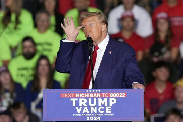 Republican presidential nominee former President Donald Trump speaks at a campaign event at the Ryder Center at Saginaw Valley State University in Michigan on Oct 3 2024 AP-Yonhap