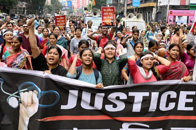 Doctors and social activists shout slogans during a rally to condemn the rape and murder of a doctor in Kolkata on Oct 2 2024 AFP-Yonhap