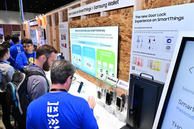 Attendees examine SmartThings and Samsung Wallet integration at SDC 2024s AI for Platform booth in San Jose Courtesy of Samsung Electronics