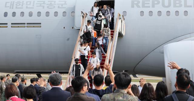 South Koreans evacuated from Lebanon disembark a KC-330 military transport plane at Seoul Air Base in Seongnam south of Seoul Oct 5 2024 Yonhap