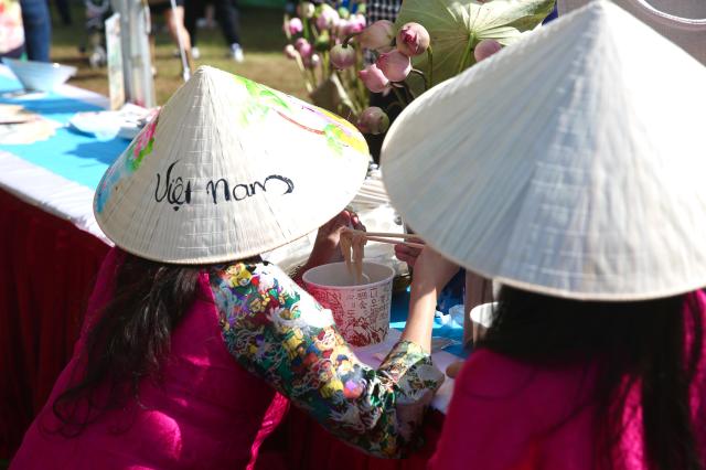 Booth staff eat phở at the Vietnam Phở Festival 2024 in Seoul Oct 5 2024 AJP Han Jun-gu