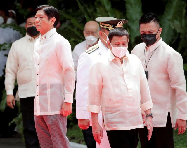 President Rodrigo right attends a ceremony in Manila Philippines June 30 2022 REUTERS-Yohap