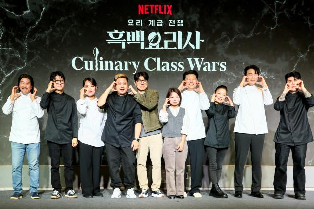 From left Edward Lee Triple Star Jung Ji-sun Cooking Maniac director Kim Hak-min director Kim Eun-ji Jang Ho-joon Auntie Omakase 1 Choi Hyun-seok and Napoli Matfia pose for a photo at the Culinary Class Wars press conference in Mapo-gu Seoul on Oct 7 2024 AJP Kim Dong-woo