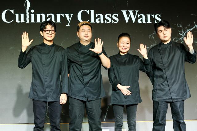 Black Spoon team members From left Triple Star Cooking Maniac Auntie Omakase 1 and Napoli Matfia pose for a photo at the Culinary Class Wars press conference in Mapo-gu Seoul on Oct 7 2024 AJP Kim Dong-woo