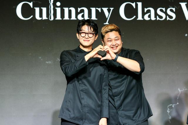 Black Spoon team members Triple Star left and Cooking Maniac pose for a photo at the Culinary Class Wars press conference in Mapo-gu Seoul on Oct 7 2024 AJP Kim Dong-woo