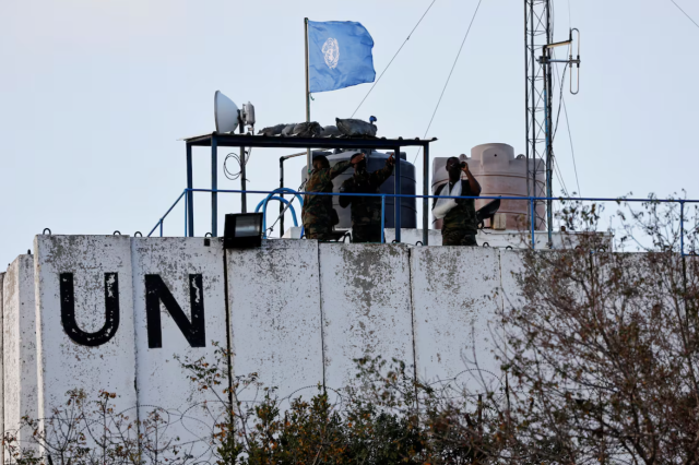 United Nations peacekeepers UNIFIL observe the Lebanese-Israeli border from the rooftop of a watchtower in the town of Marwahin southern Lebanon on October 12 2023 Reuters-Yonhap