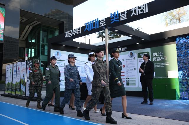 Models in military uniforms perform a changing of the guard ceremony at the Military veterans week event at COEX in Seoul on Oct 8 2024 AJP Han Jun-gu